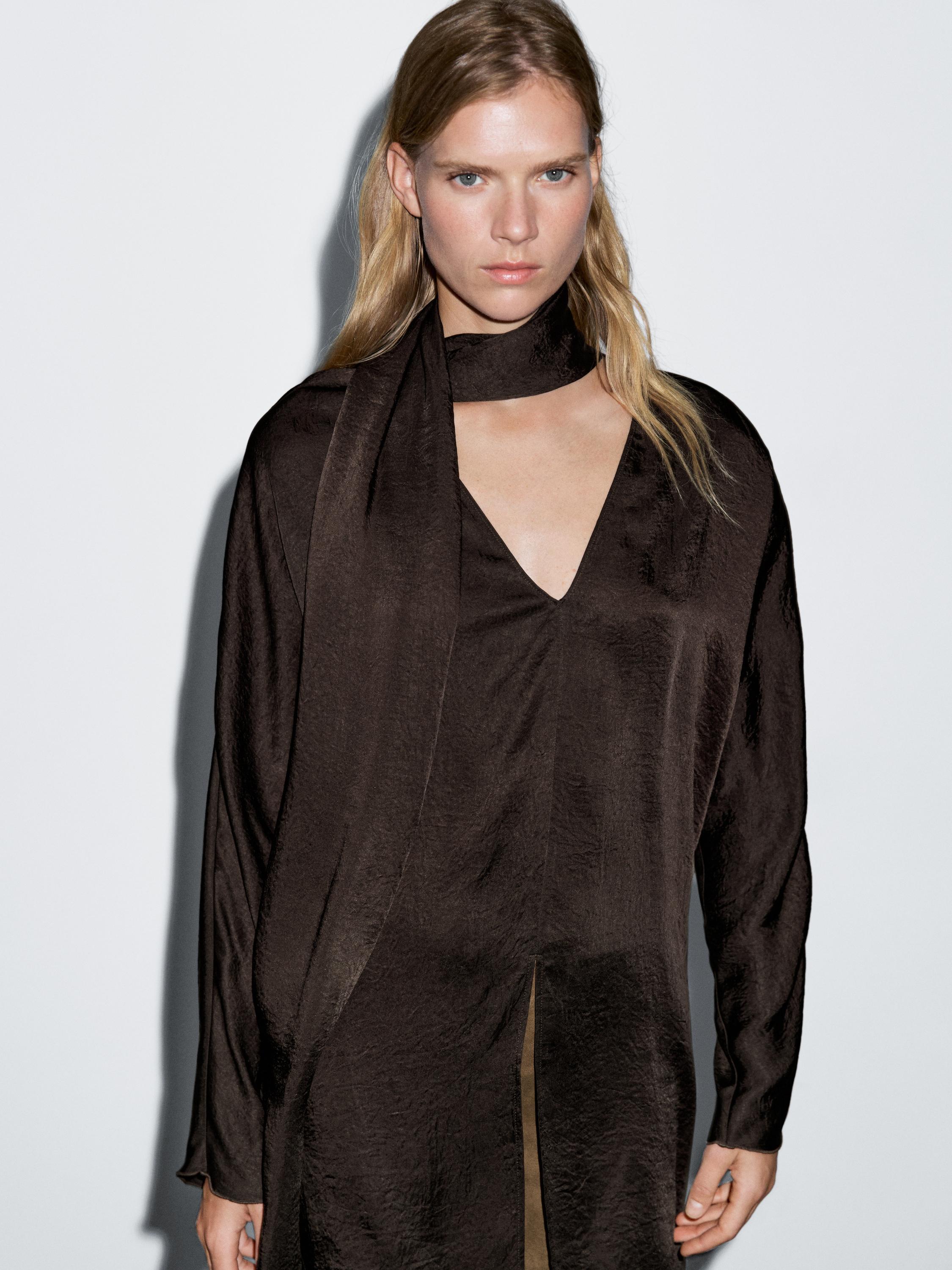 Long flowing blouse with tied neck